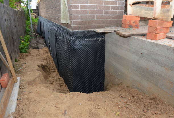 SJ Waterproofing Pros technician performing targeted Exterior Waterproofing assessment in York, AL
